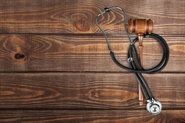 Wooden gavel and stethoscope