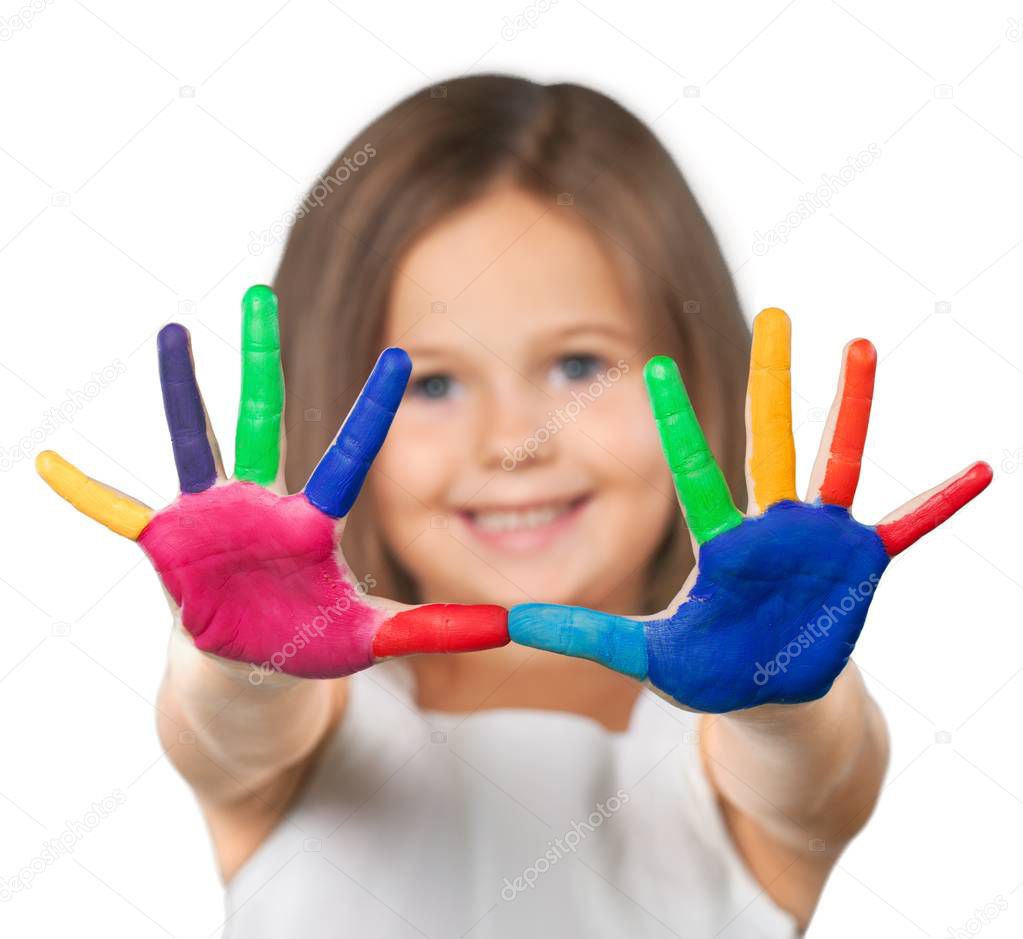 Little girl showing painted hands isolated on white background