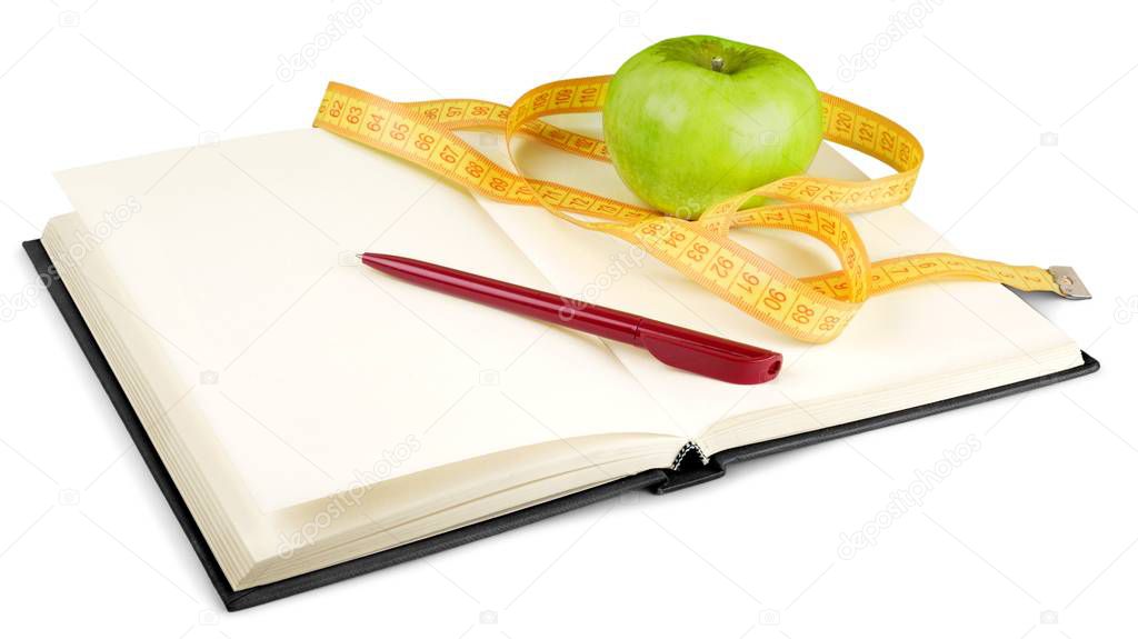 Fresh apple with measuring tape and notebook isolated on white 