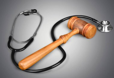Wooden gavel and stethoscope clipart