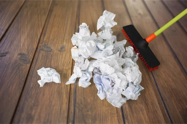 Mopping crumpled pile of papers — Stock Photo, Image