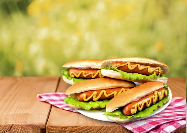 Tasty hot dogs on plate — Stock Photo, Image