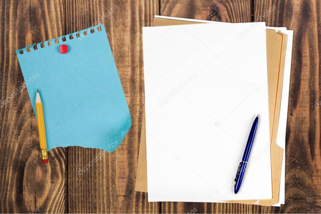 Yellow file folder and pen