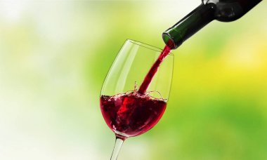 Red wine pouring in glass clipart