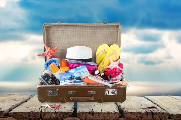 Retro suitcase with travel objects — Stock Photo, Image