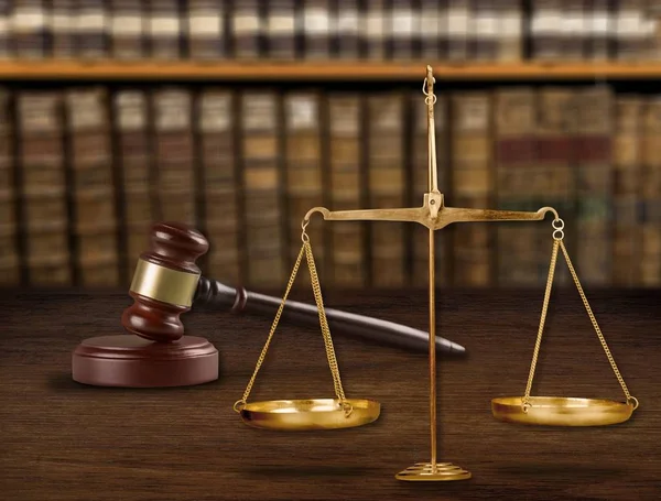 Justice Scales and wooden gavel on table
