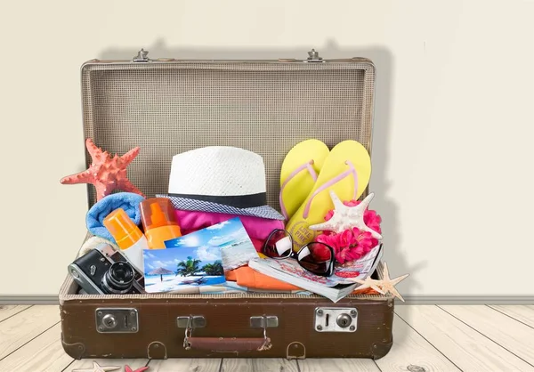 Retro suitcase with travel objects — Stock Photo, Image