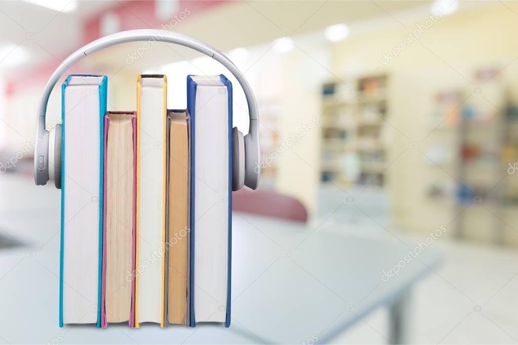 Stack of Books and headphones