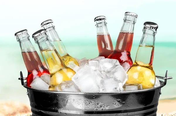 Beer bottles with ice — Stock Photo, Image