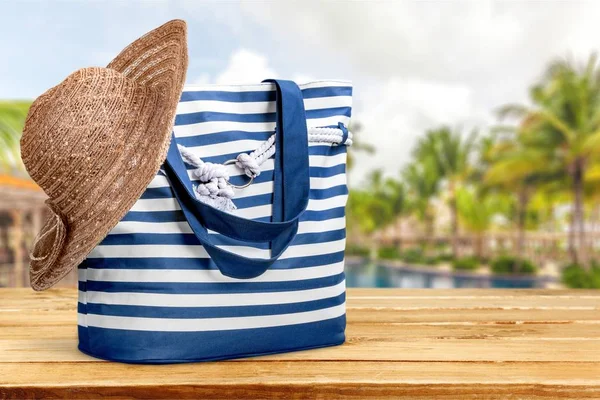 Beach bag on pool — Stock Photo, Image