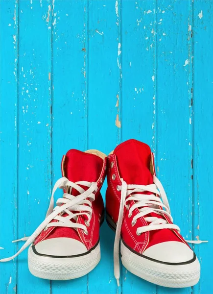 Hanged Red Sneakers On Black Wallpaper Stock Photo - Download Image Now -  Canvas Shoe, Hanging, Casual Clothing - iStock