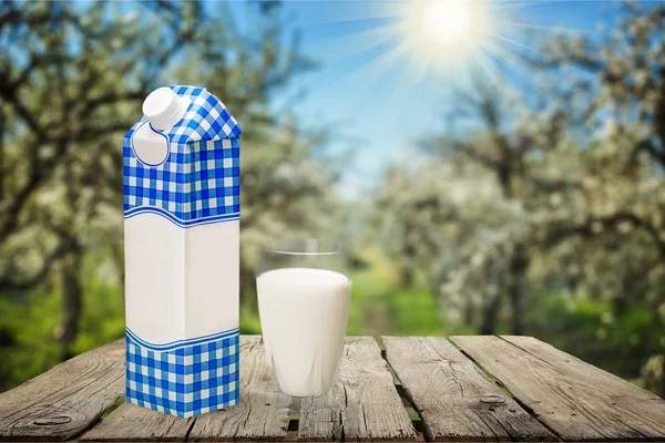 Milk in glass and box