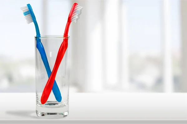 Colorful Toothbrushes in  lass — Stock Photo, Image