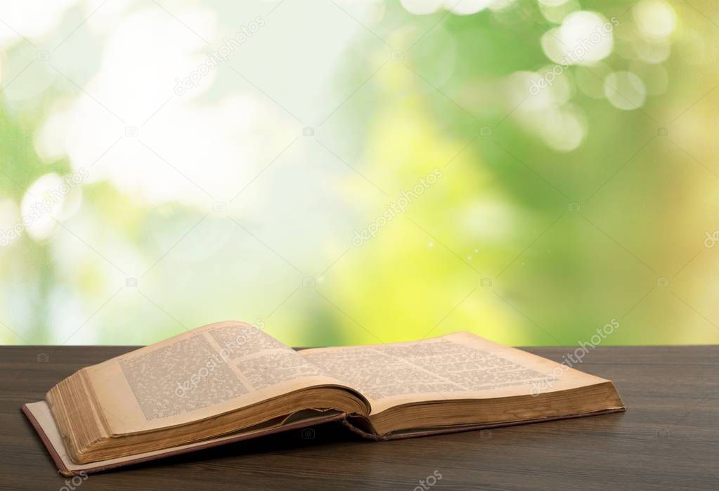 Holy bible book on wooden background