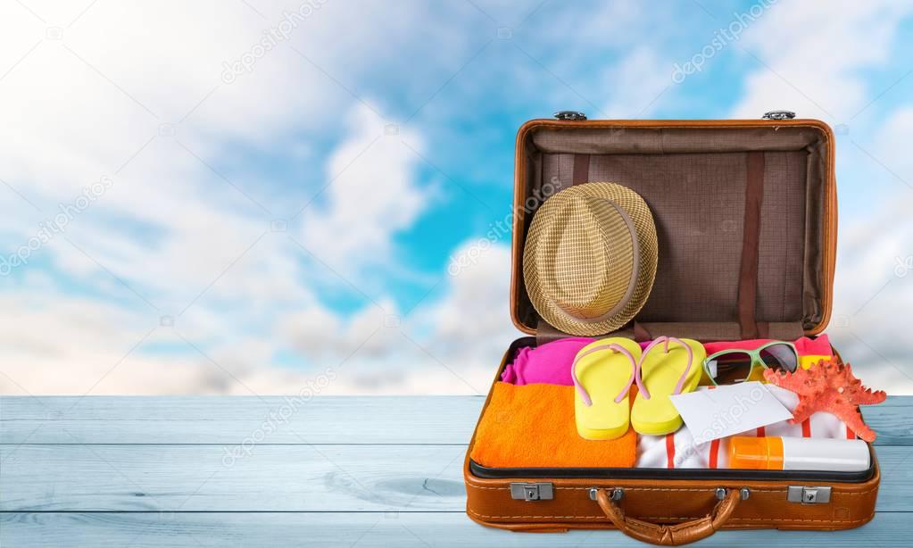 Retro suitcase with travel objects