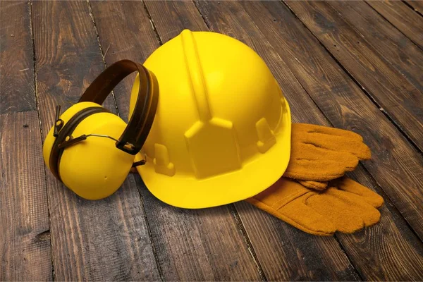 Yellow helmet with equipment — Stock Photo, Image