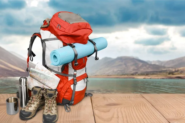 Backpack, Hiking boots, compass and map