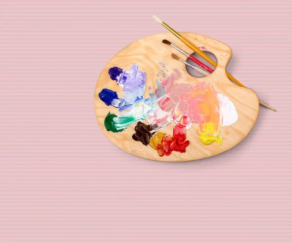 Artist brushes and paint palette — Stock Photo, Image