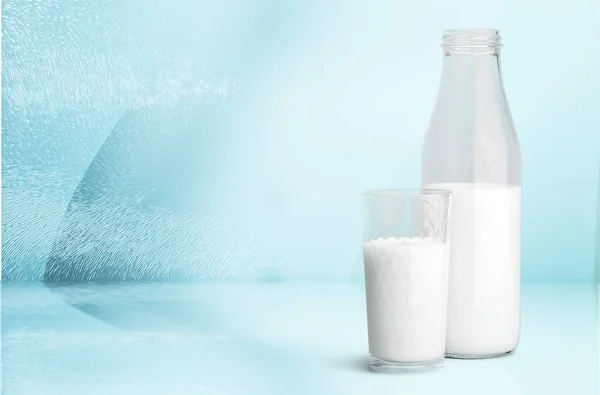 Milk in glass and bottle on  table