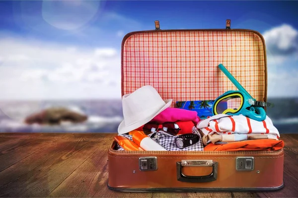 Retro suitcase with travel objects — Stock Photo, Image