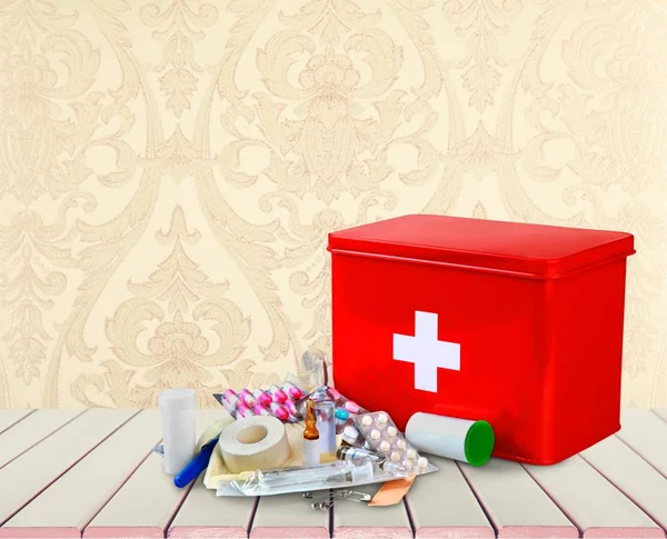 First aid kit with medical supplies — Stock Photo, Image