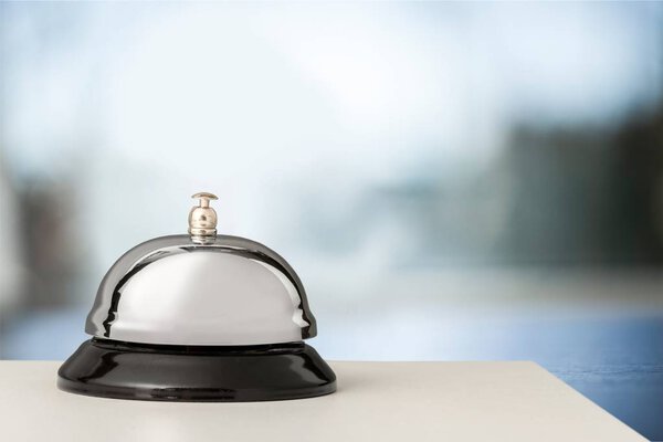 Reception service desk bell on blurred background 