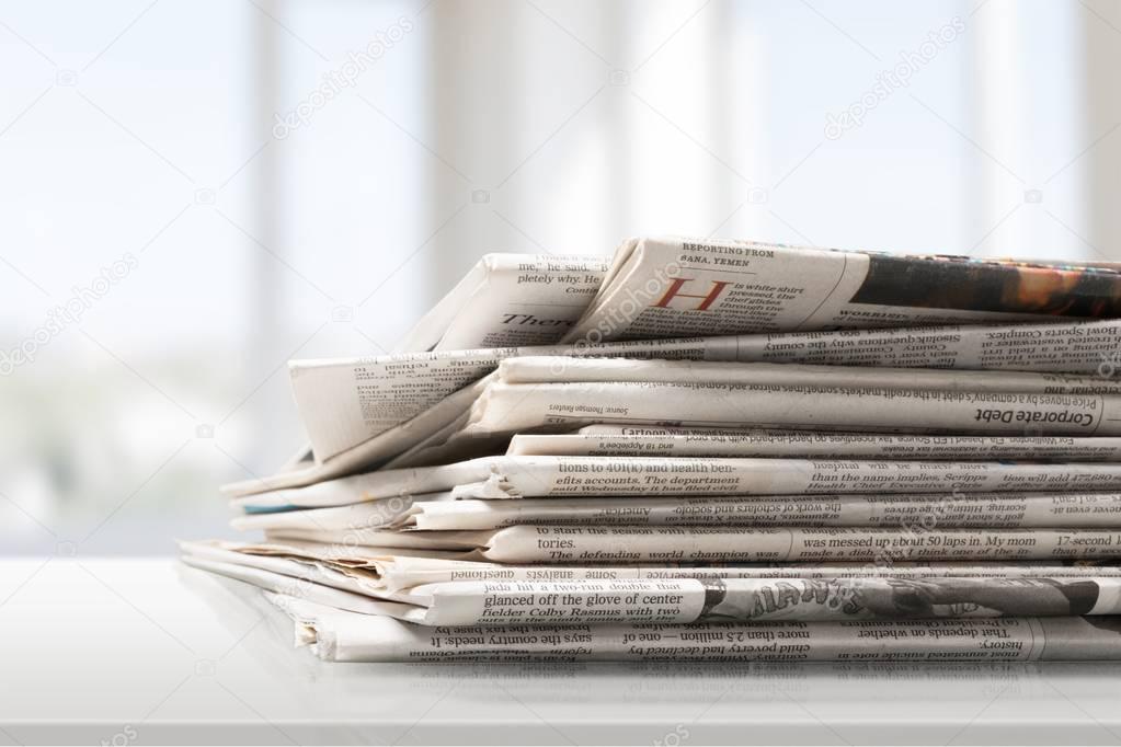 Pile of printed newspapers