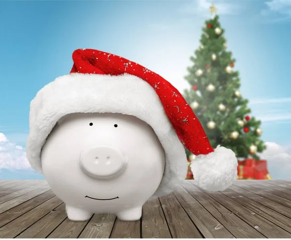 Piggy bank with Santa Claus hat — Stock Photo, Image
