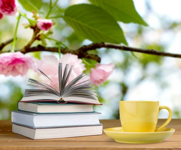 Coffee in cup with books — Stock Photo, Image