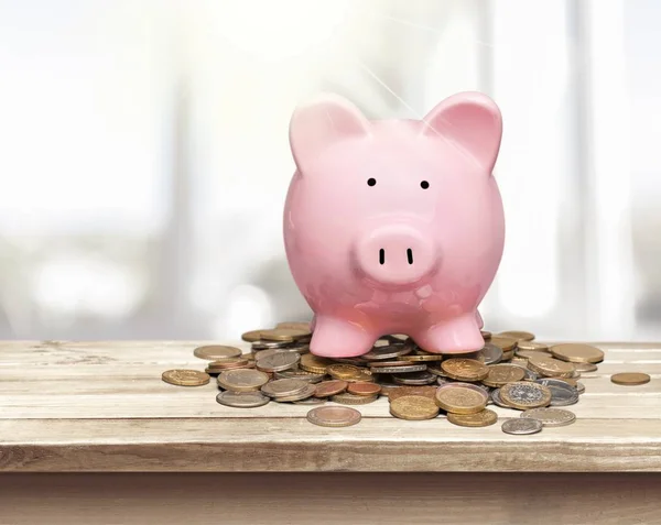 Piggy bank and coins — Stock Photo, Image