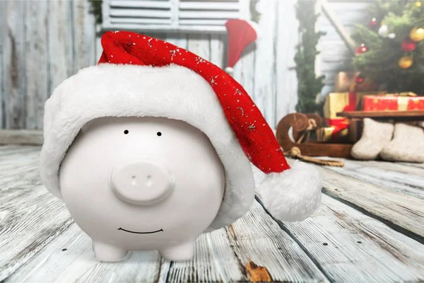 Piggy bank with Santa Claus hat — Stock Photo, Image