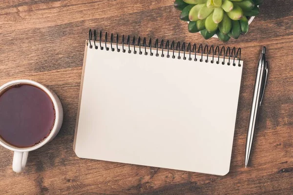 Smartphone with notebook and cup of  coffee — Stock Photo, Image