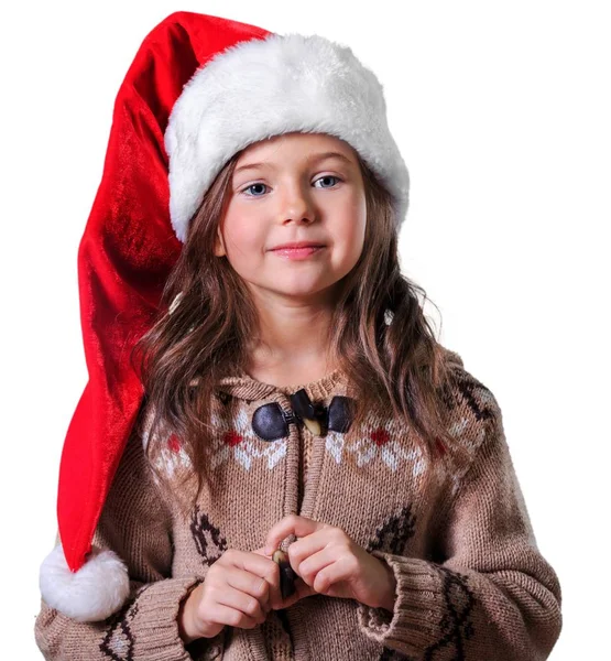 Beyaz arka plan üzerinde izole kırmızı Noel Baba şapkası, sevimli küçük kız
