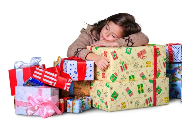 Kleines Mädchen mit Geschenkschachteln — Stockfoto