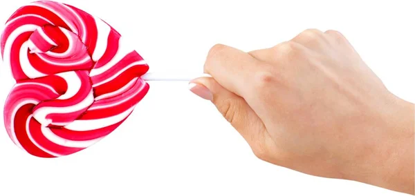 Hand holding lollypop — Stock Photo, Image