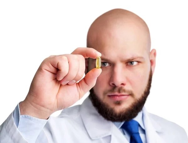 Dokter memegang pil — Stok Foto