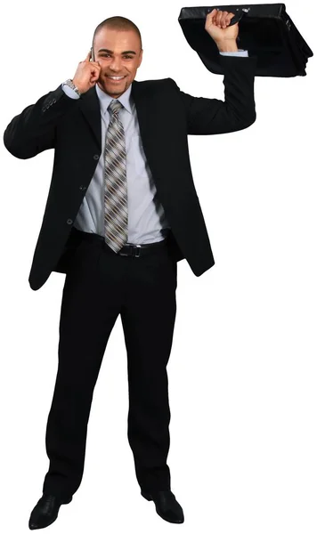 Hombre de negocios sosteniendo caso negro —  Fotos de Stock