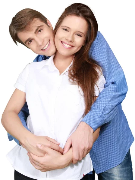 boldog, fiatal pár, átölelve a elszigetelt fehér háttér