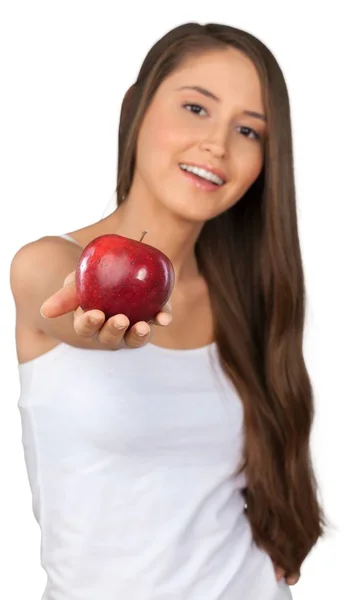 Młoda kobieta trzyma jabłko — Zdjęcie stockowe