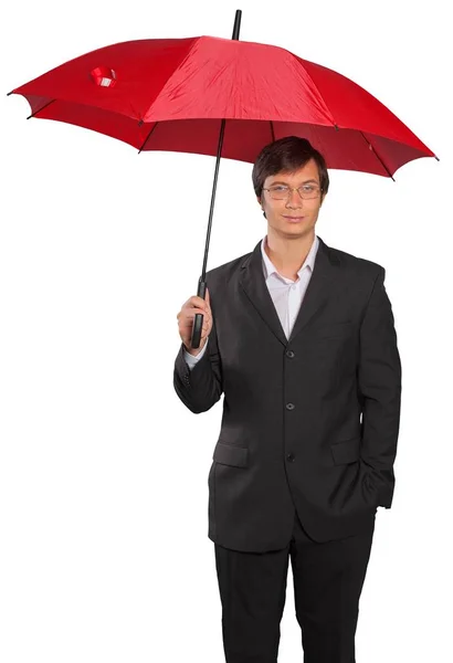Confident businessman with umbrella — Stock Photo, Image