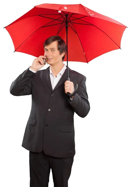 Selbstbewusster Geschäftsmann mit Regenschirm — Stockfoto