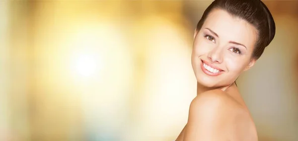 young charming woman with clean skin on background
