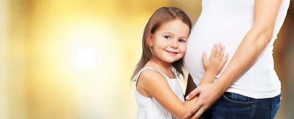 Pregnant woman with her daughter — Stock Photo, Image