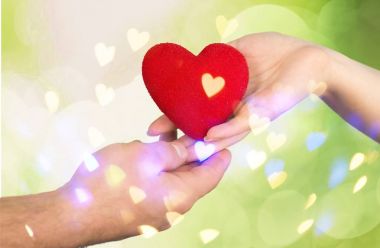 Close-up red Heart in hands, love concept clipart
