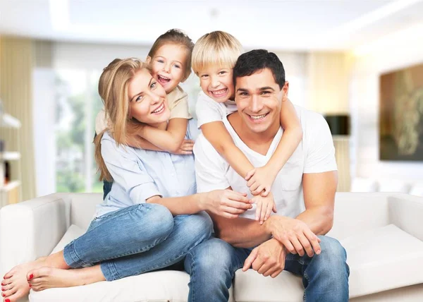 Young  family at home — Stock Photo, Image