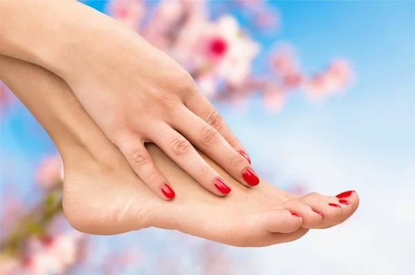 Manicured nails and pedicured toes — Stock Photo, Image