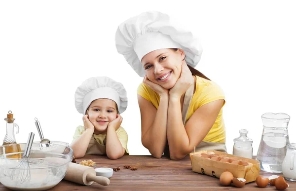 Chica y su madre horneando juntos —  Fotos de Stock