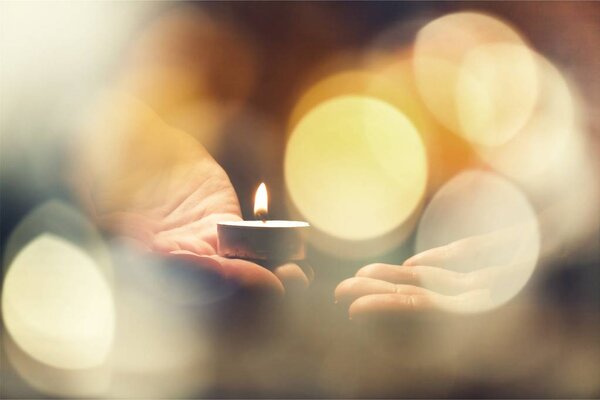 candle in male hands
