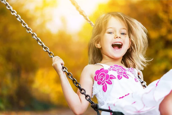 Little girl on swing — Stock Photo, Image