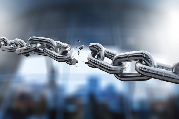 Broken metal chain on blurred background 